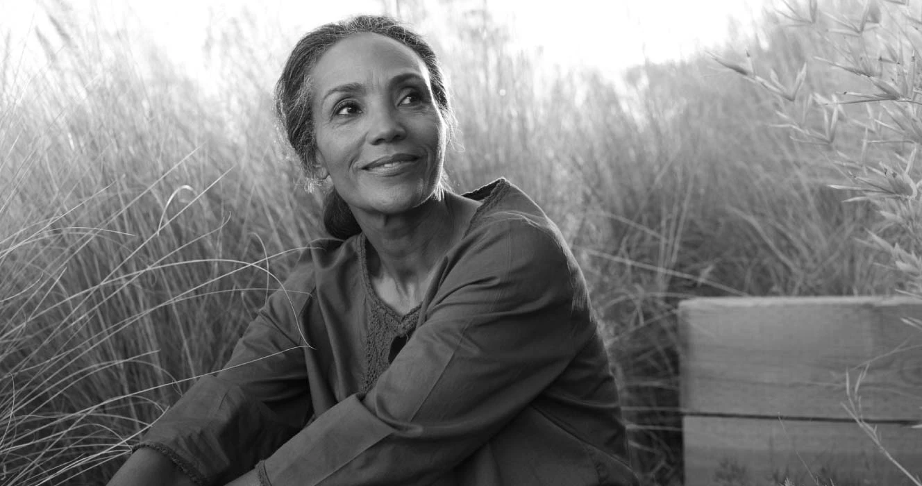 A woman out in the field relaxing