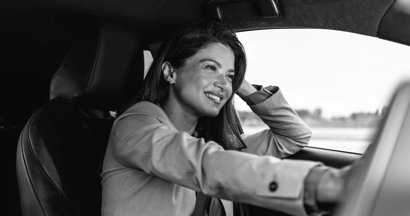 A woman driving in her car