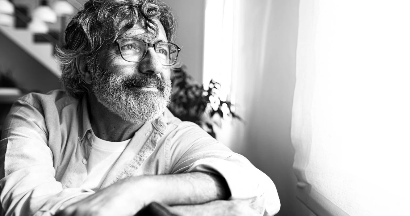 A man looking out the window